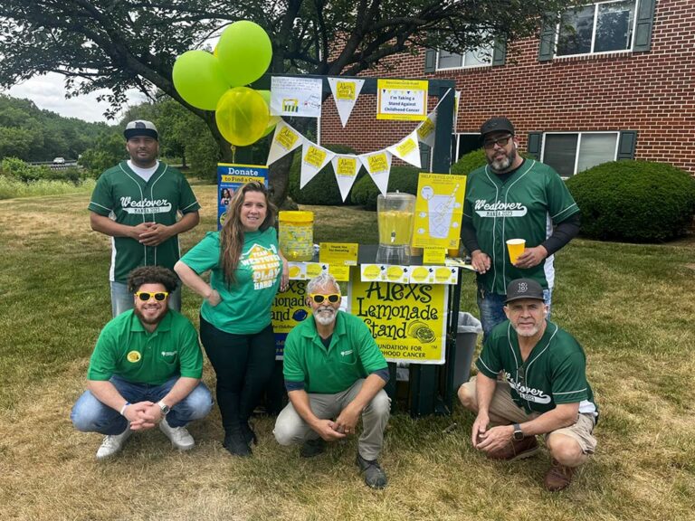 Volunteers posing for a photo at the lemonade stand